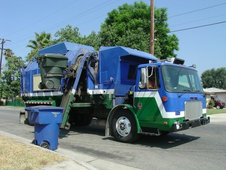 Residential property with a skip container on the driveway